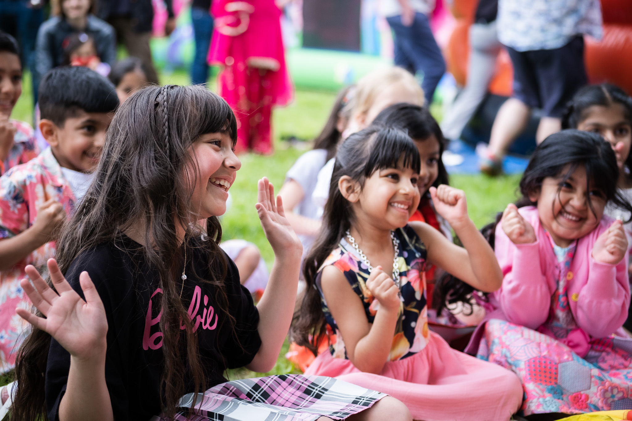 Group of kids, celebrating a birthday party, having a great time laughing 