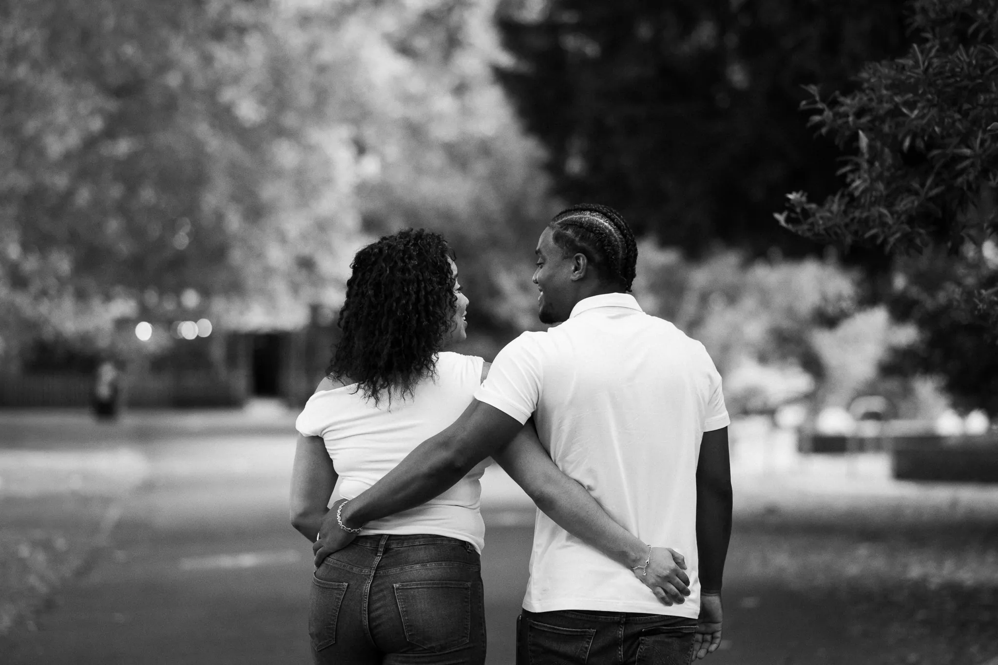 Couple walking in park, hugging enjoying time together